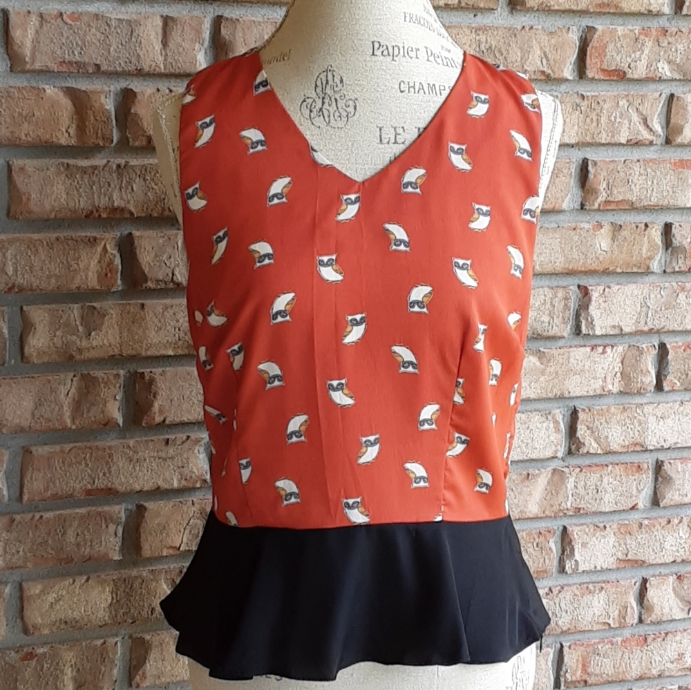Rhyme & Echo Novelty Print Peplum Sleeveless Top.